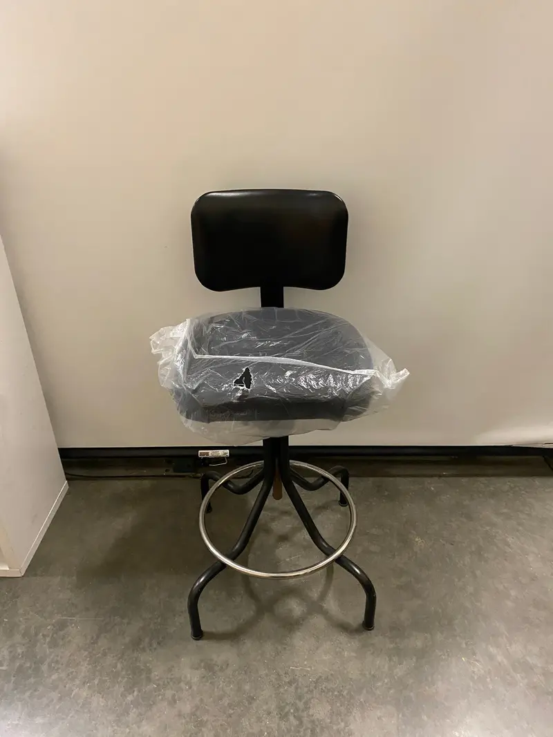 Black Backless Stool with Supportive Backrest – Indoor Use